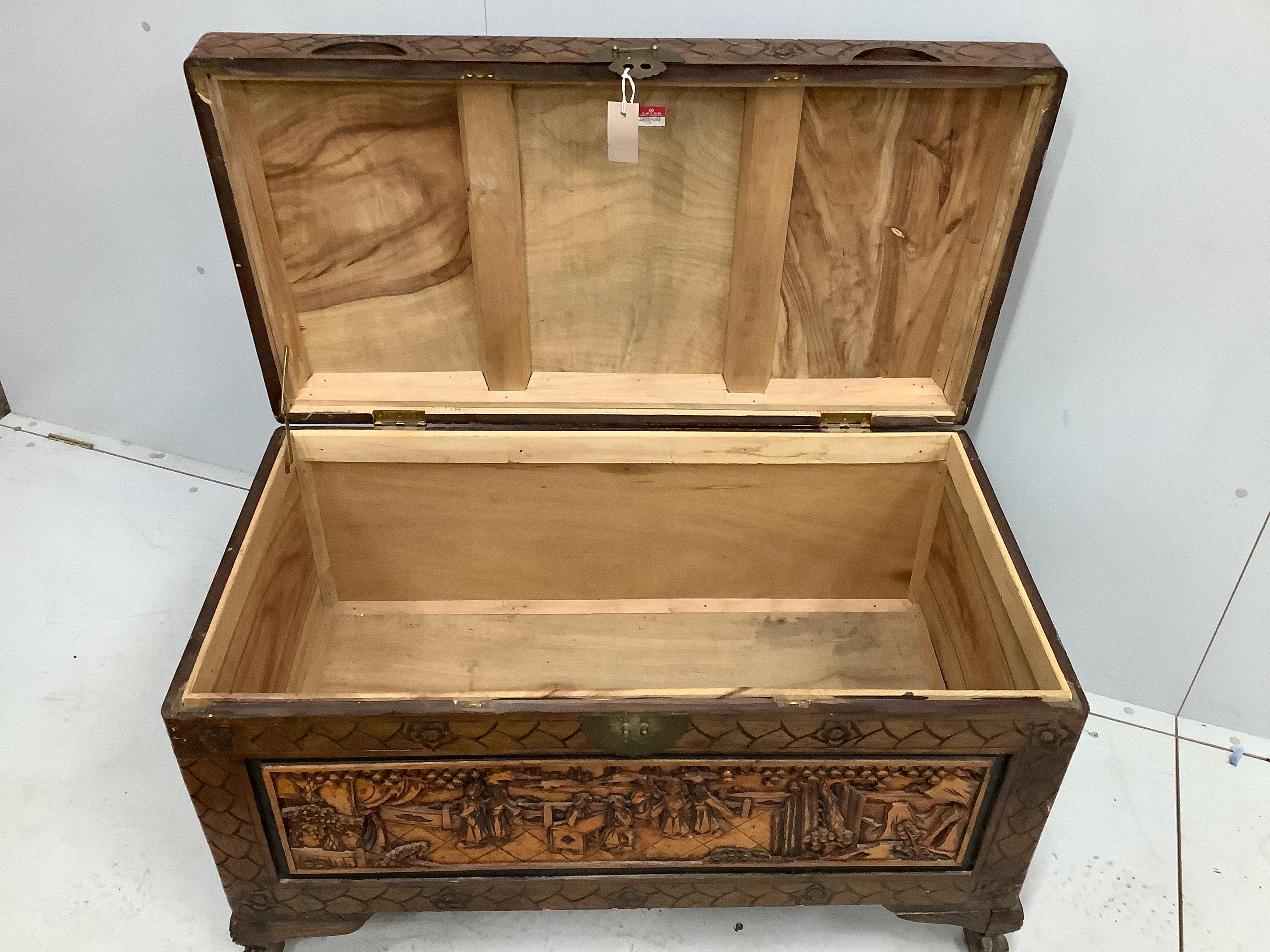 A Chinese carved camphorwood trunk, width 100cm, depth 52cm, height 60cm